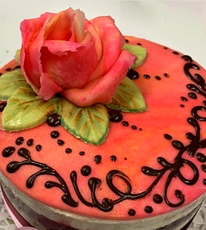 Queen Isabella cake topped in marzipan with a marzipan rose